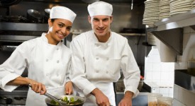 Male and female chefs in restaurant kitchen